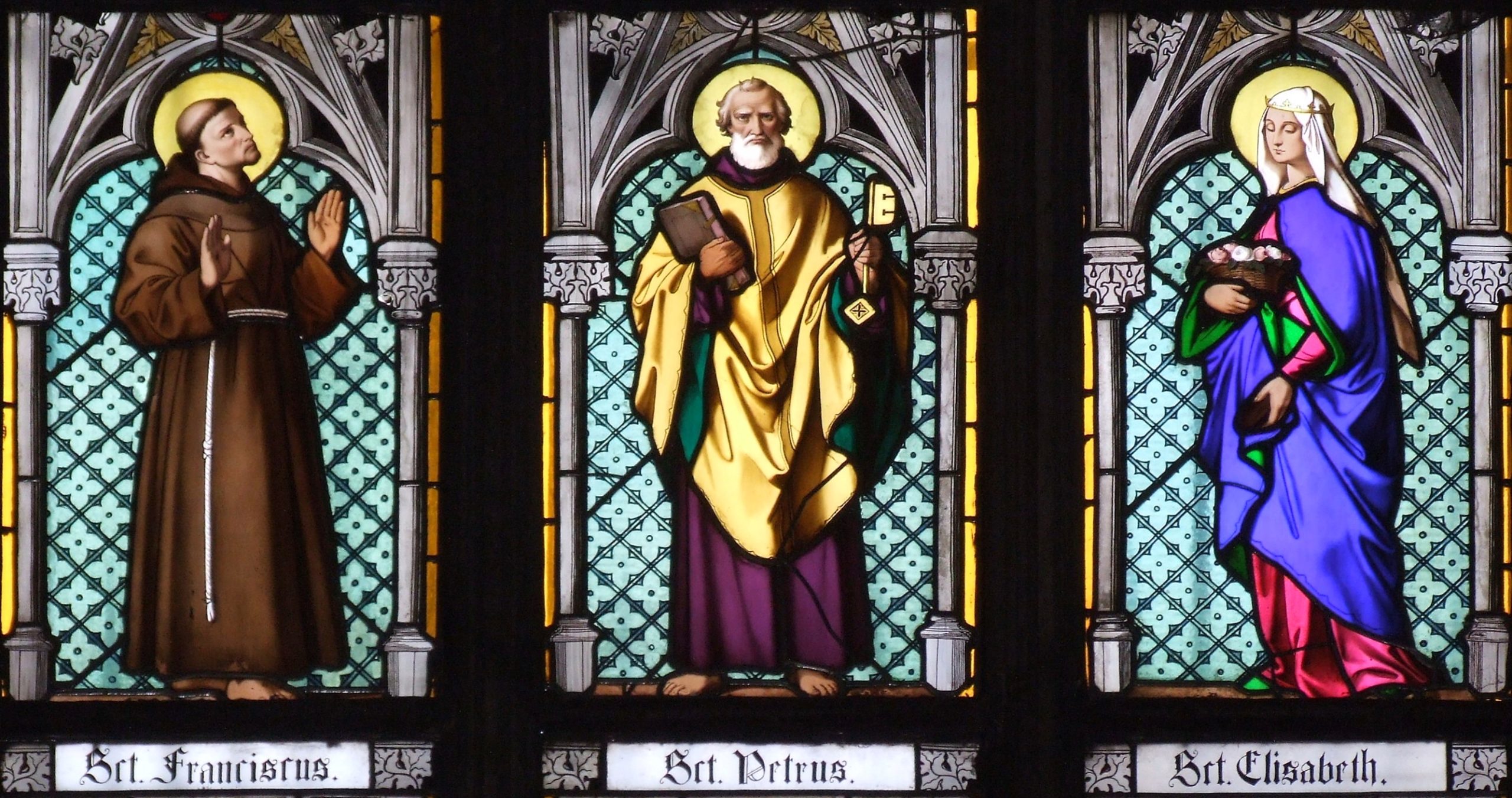 Light pours through the stained glass of St. Vitus Cathedral, the spiritual centerpiece of the castle.