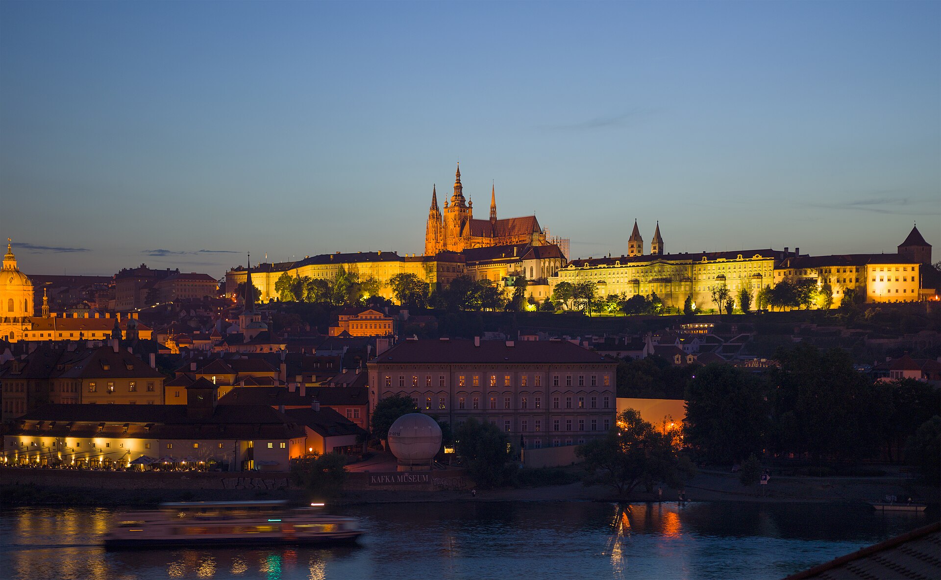 Prague Castle and the spires of St Vitus Cathedral crowning the ridge above the city