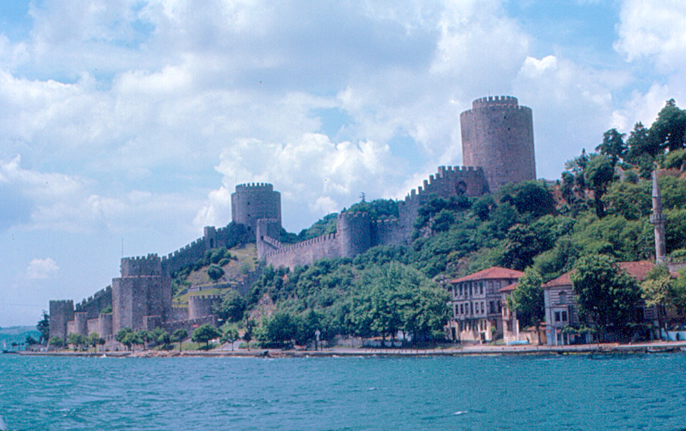 Rumeli Hisarı rises on the European shore of the Bosphorus, at the strait's narrowest point.