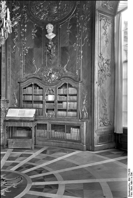 Frederick's library, a small circular room paneled in cedar and filled with French and classical works