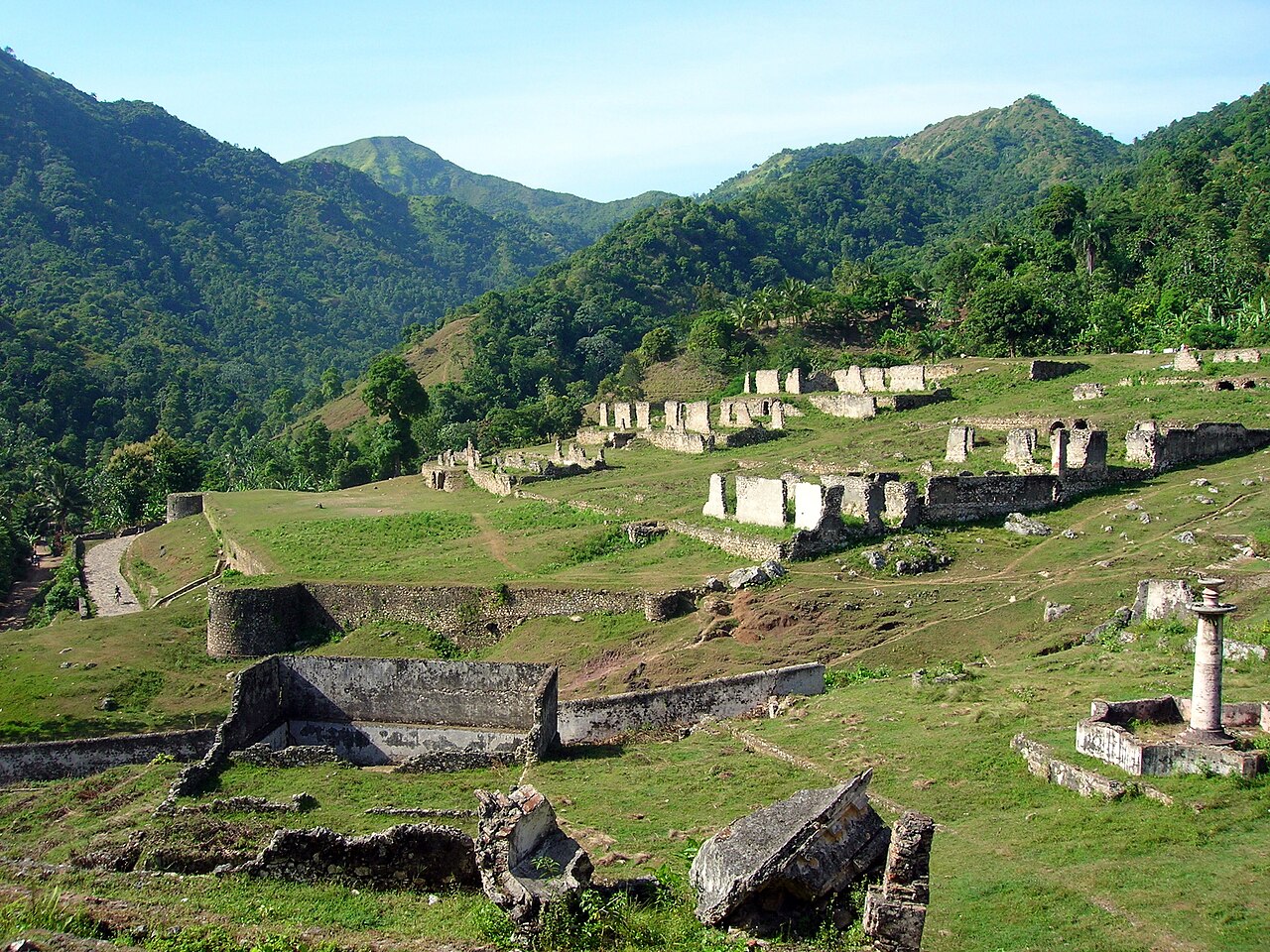 The terraced gardens climbing the hillside beside the palace.