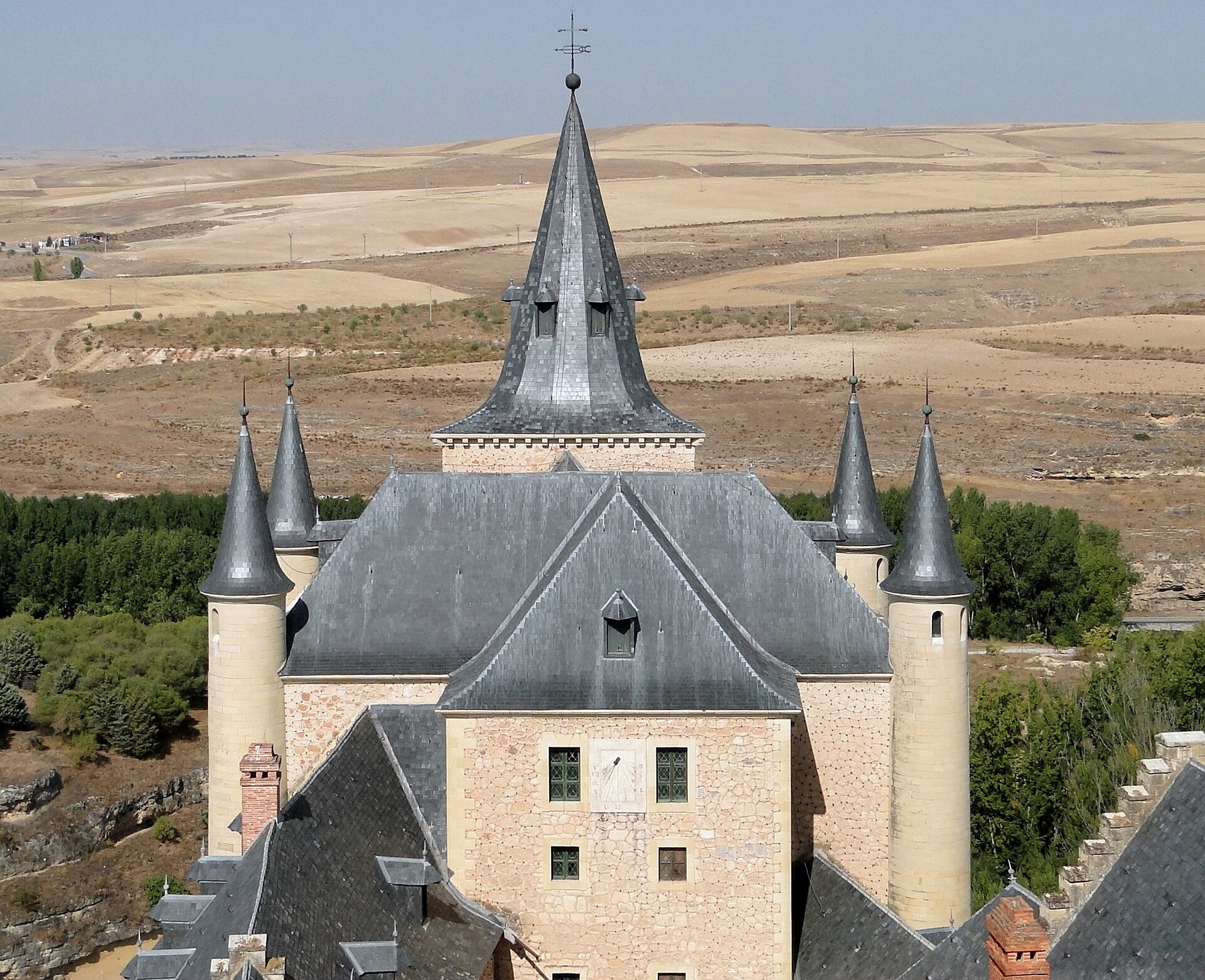 A Spanish king crowned the towers with sharp slate spires from central Europe.