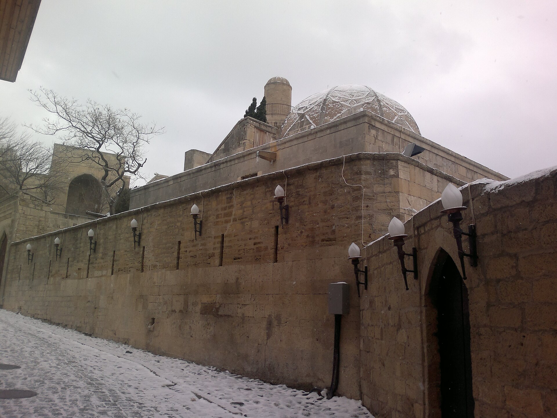 A winter view of the stone buildings and courtyards
