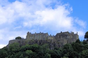 Stirling's towers and walls rising above the plain, guarding the lowest crossing of the River Forth