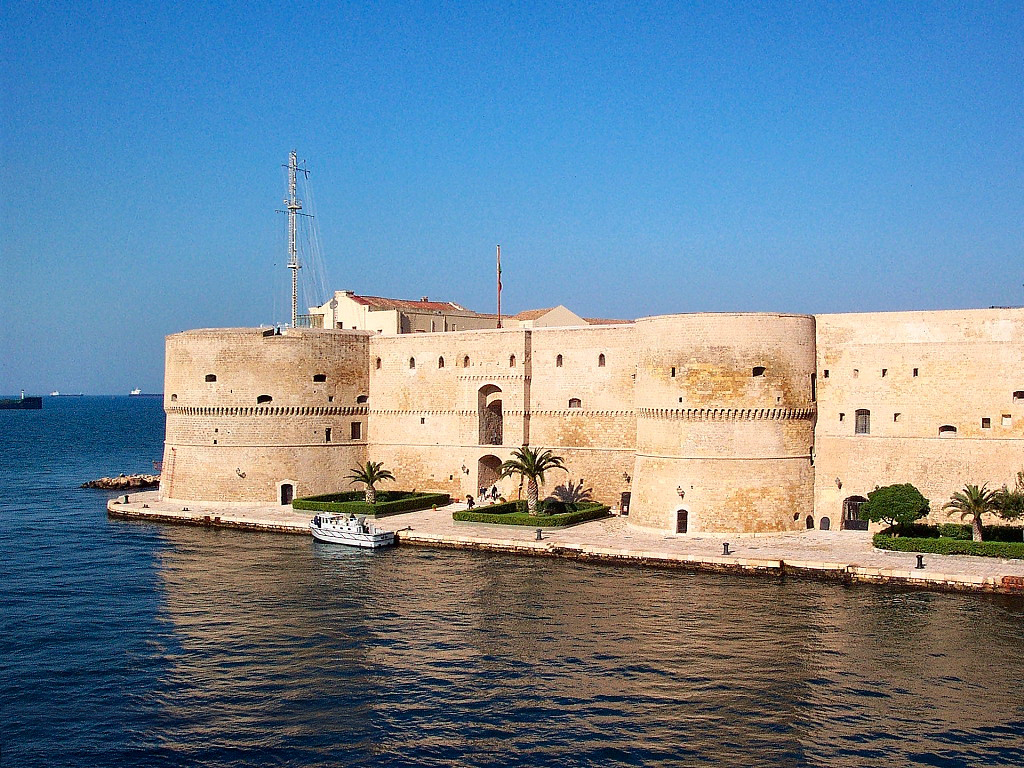 The castle guards the channel where the Mar Grande meets the Mar Piccolo.