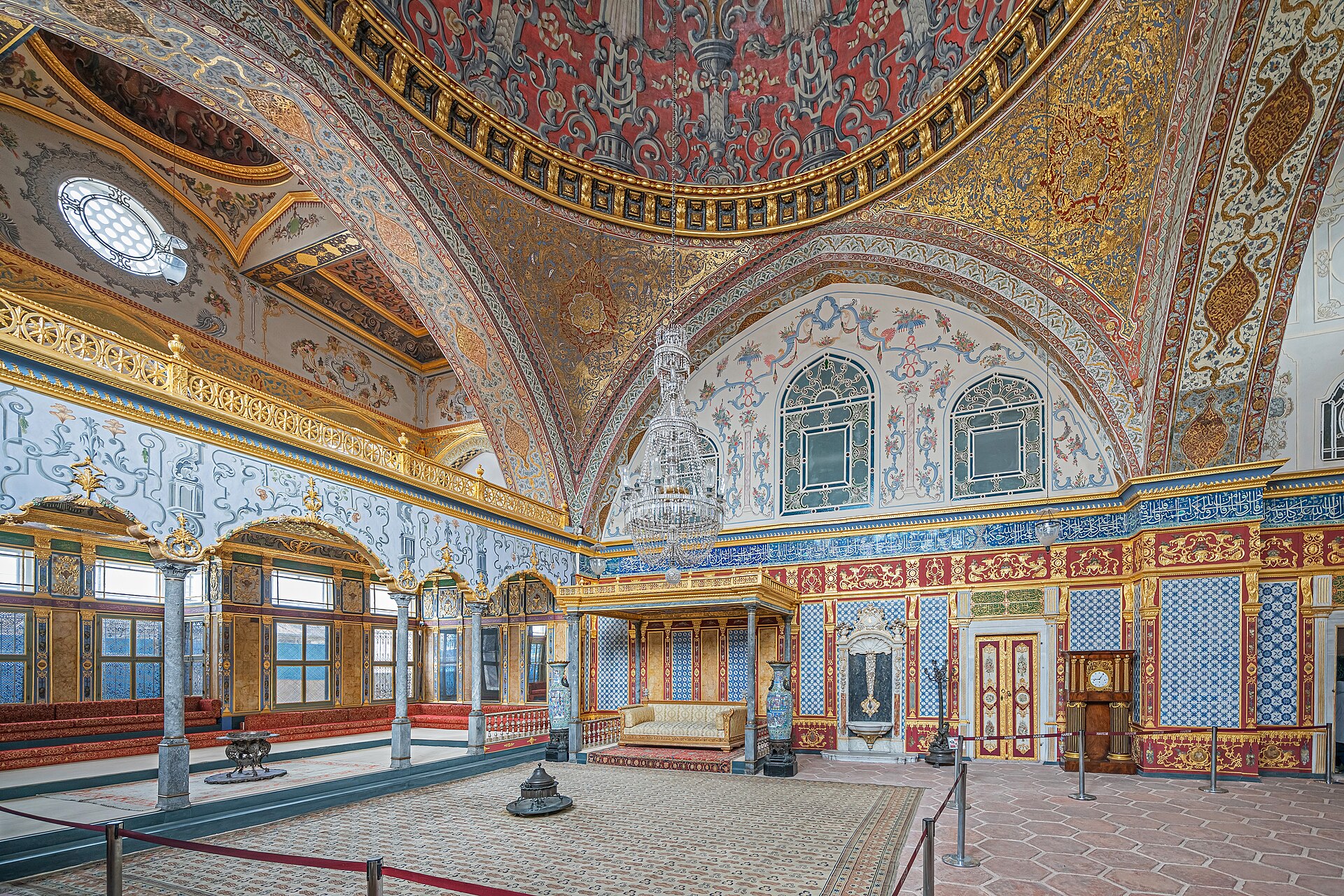 The intricate decoration of the palace interiors, built from tile, wood, and calligraphy.