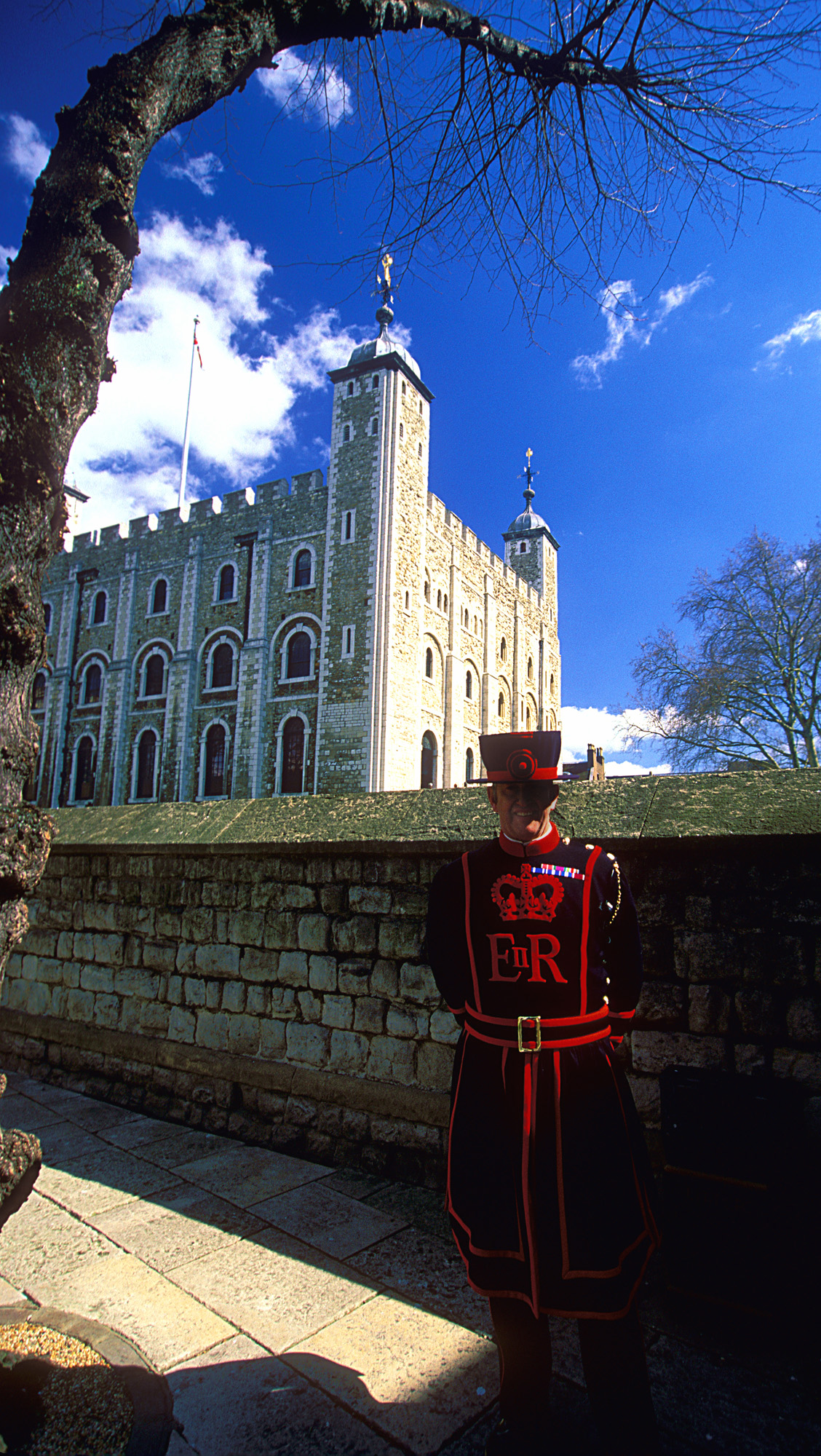 A Yeoman Warder, or Beefeater, one of the ceremonial guardians who still live inside the Tower