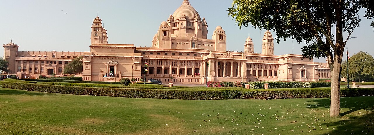 The exterior of Umaid Bhawan, in golden Jodhpur sandstone.