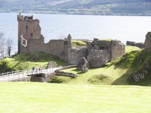 The ruined castle seen from a distance along the loch, guarding the Great Glen