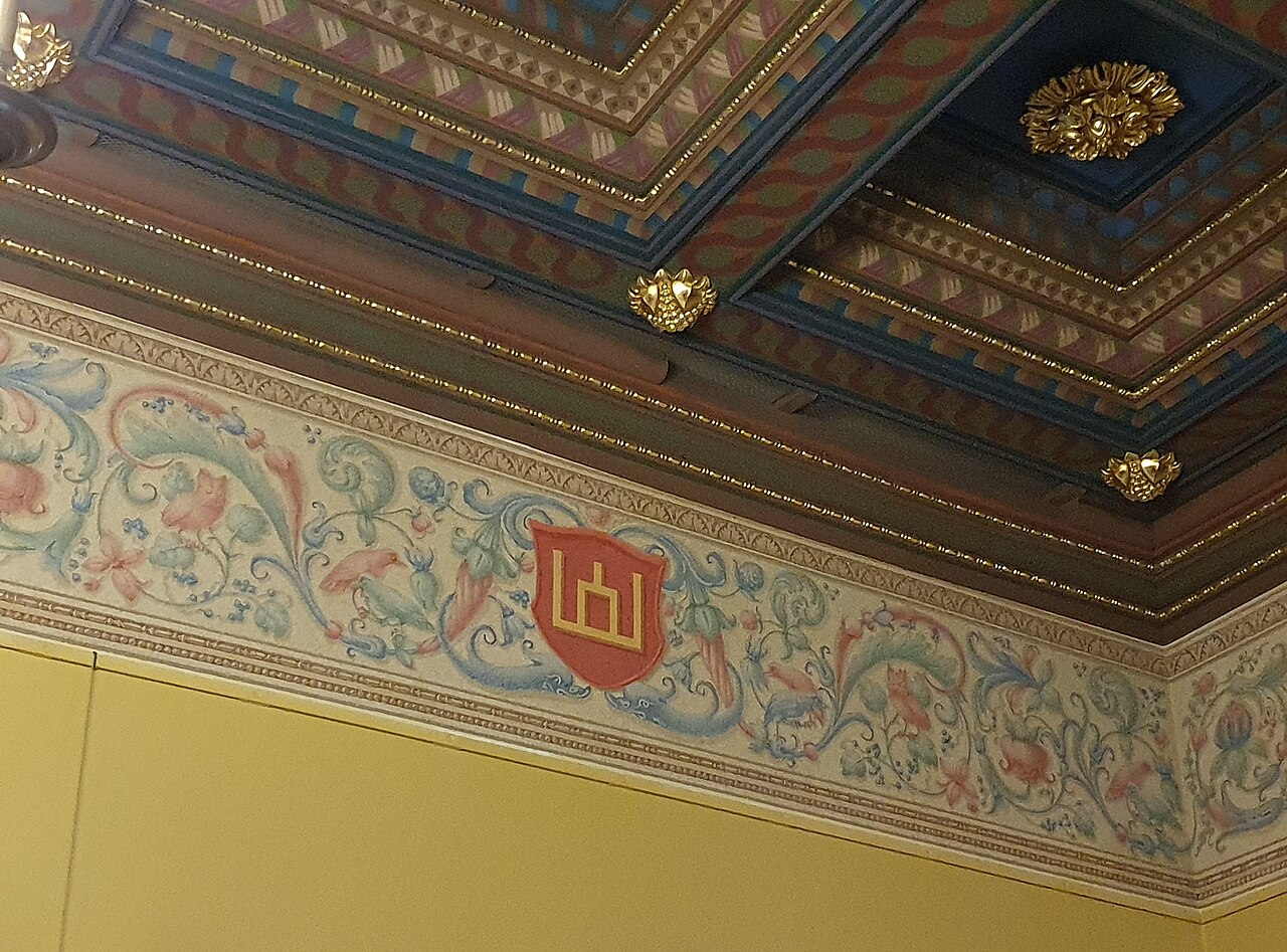 The Columns of Gediminas displayed in a palace hall.