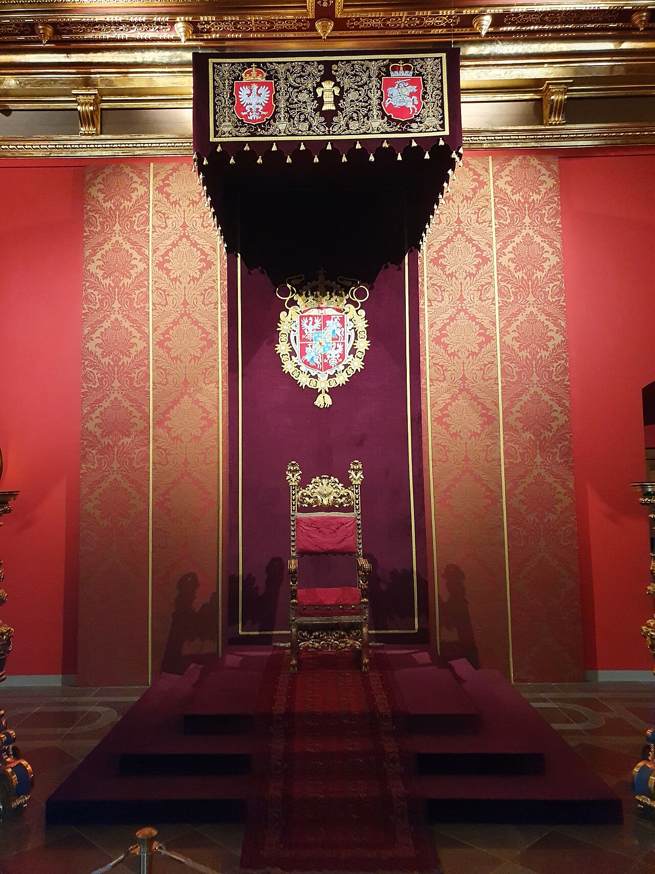 The throne beneath its canopy in the throne room.