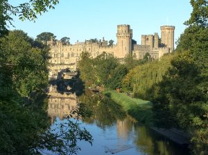 Warwick Castle mirrored in the River Avon, one of the most complete medieval castles in England