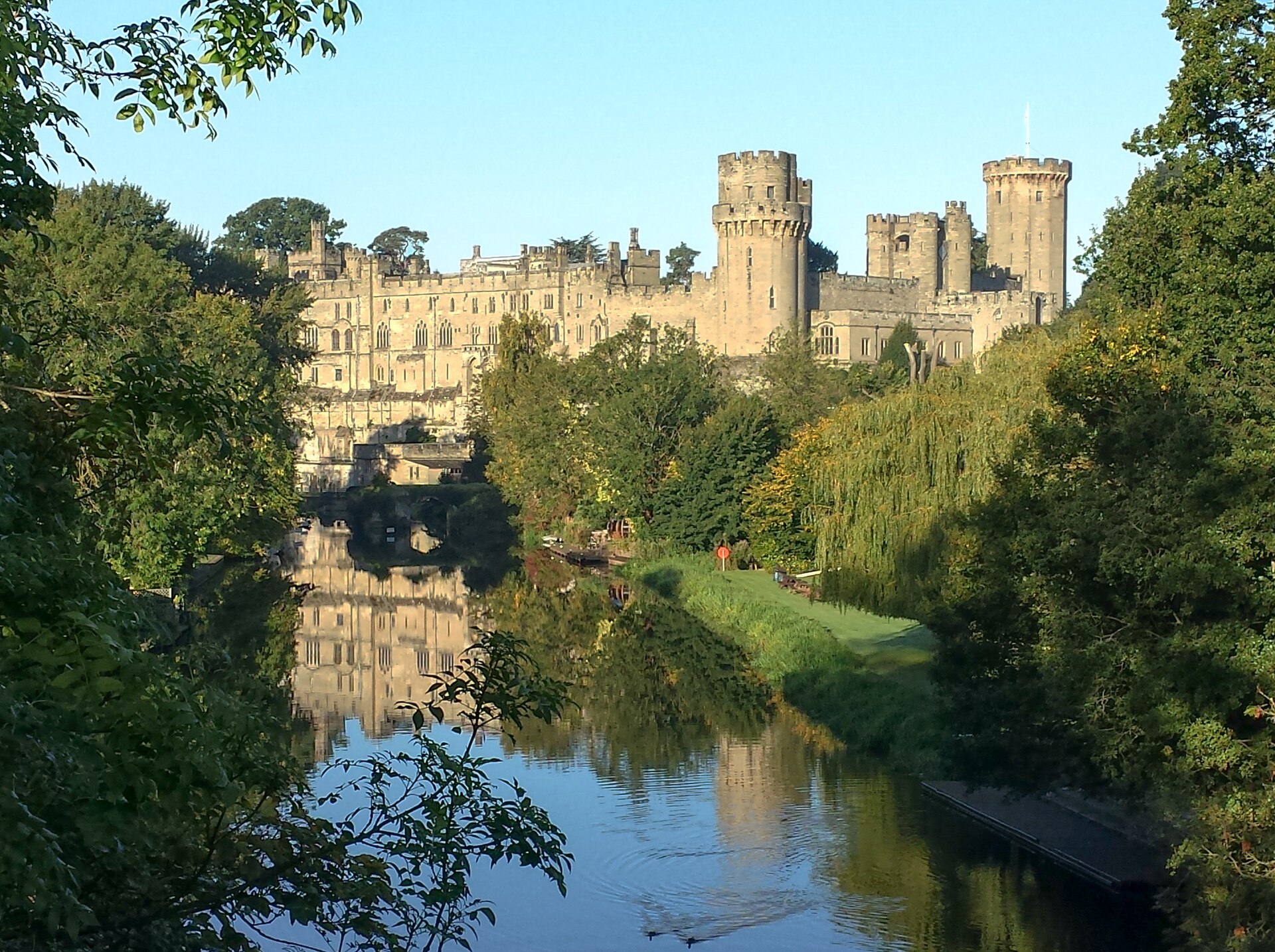 Warwick Castle mirrored in the River Avon, one of the most complete medieval castles in England