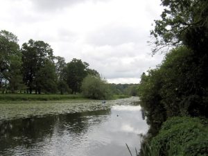 The Avon flowing beneath the castle, with its old mill and engine house on the bank