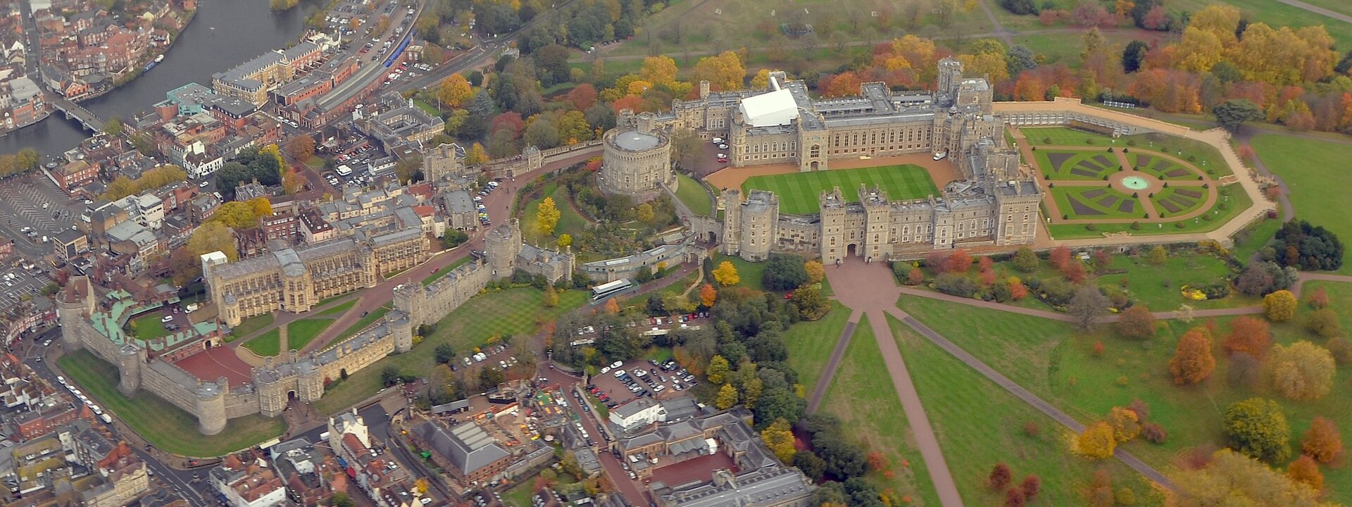 Windsor Castle from the air, the largest and oldest occupied castle in the world, spread along its ridge above the Thames