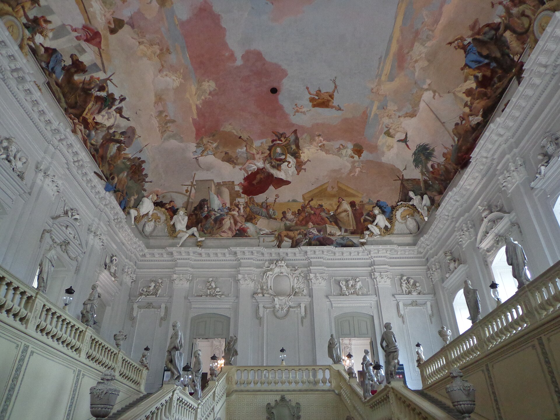 The grand staircase of the Residence, roofed by Balthasar Neumann's unsupported vault beneath Tiepolo's fresco