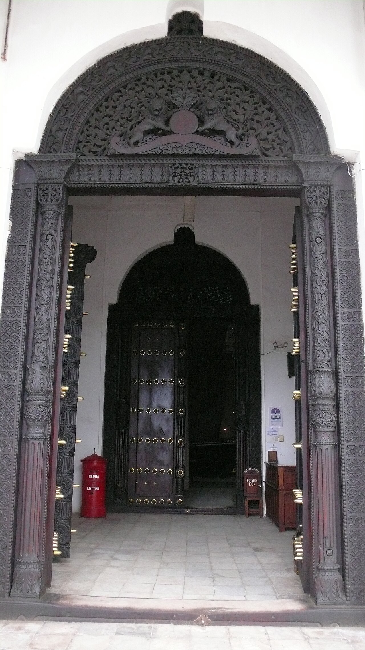 One of the great carved and brass-studded doors of the palace.