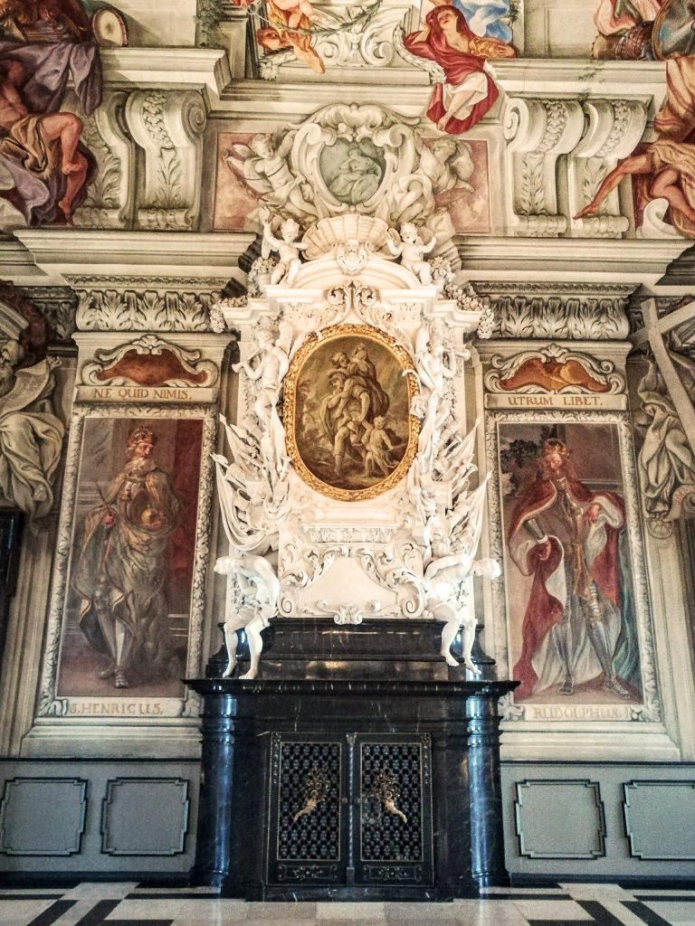 A sculpted fireplace in the state rooms