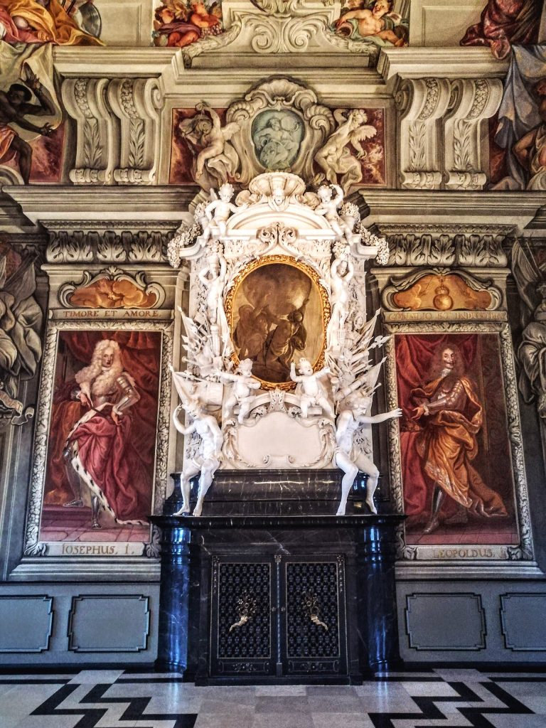 A fireplace with the figure of Atlas