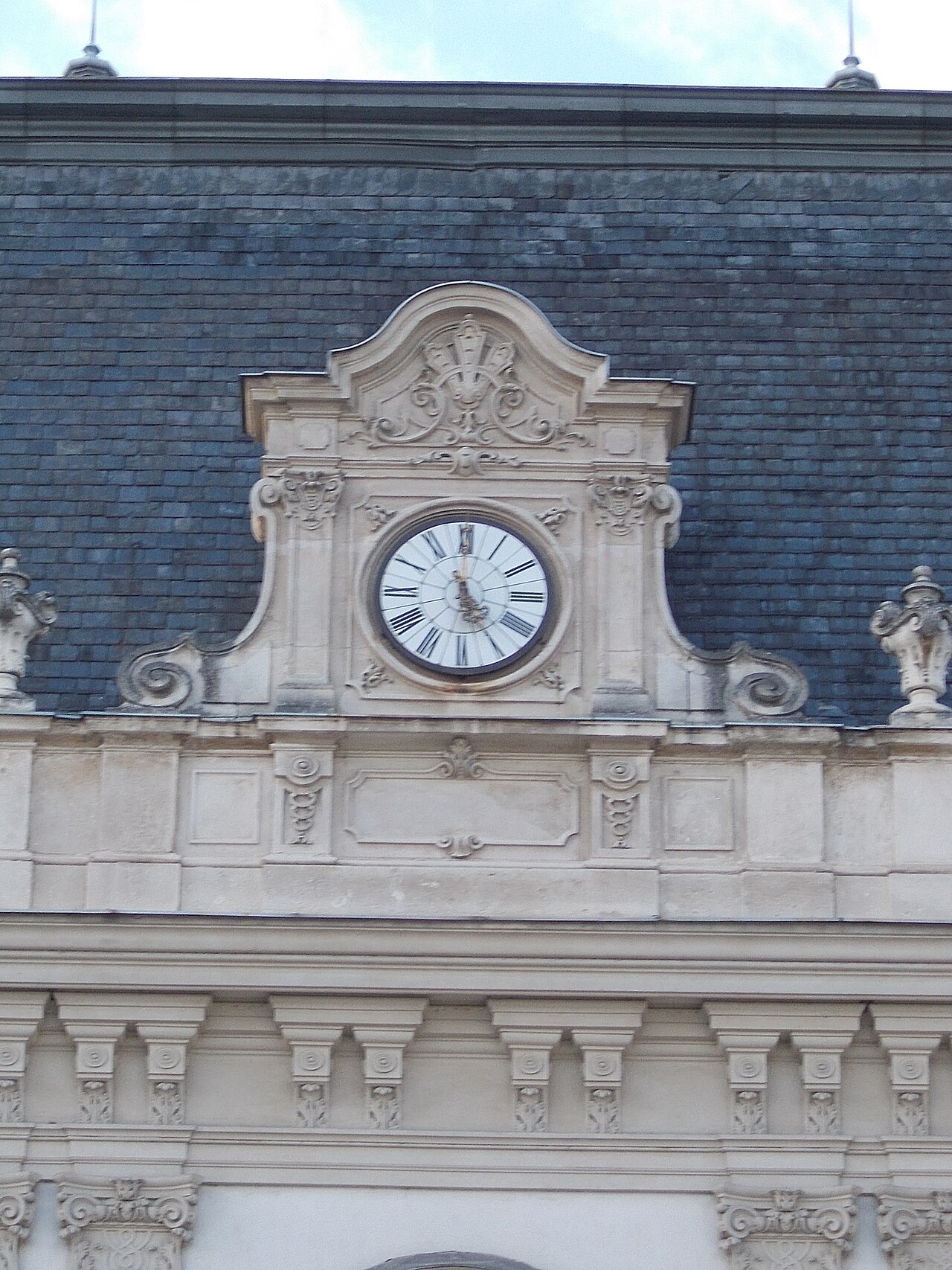 The coat of arms and statues on the main building