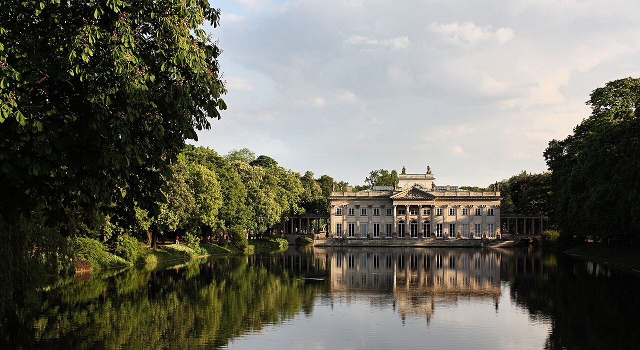 The neoclassical Palace on the Isle reflected in its lake in Warsaw