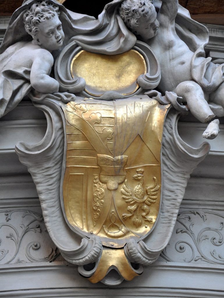 The princely coat of arms above the portal