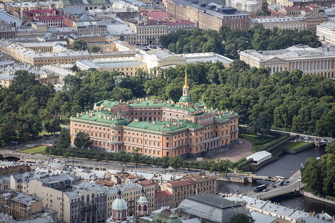 The reddish orange south facade of Mikhailovsky Castle in Saint Petersburg