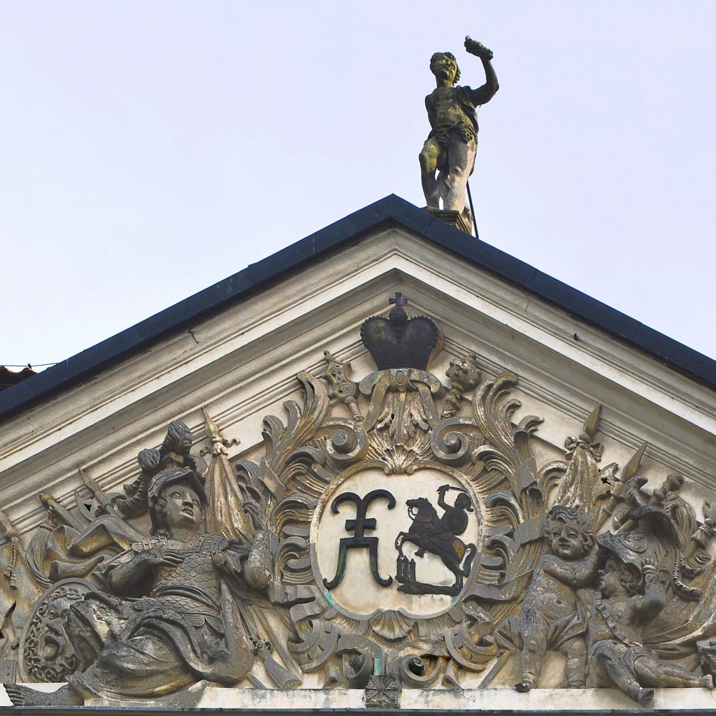 The coat of arms above the palace entrance