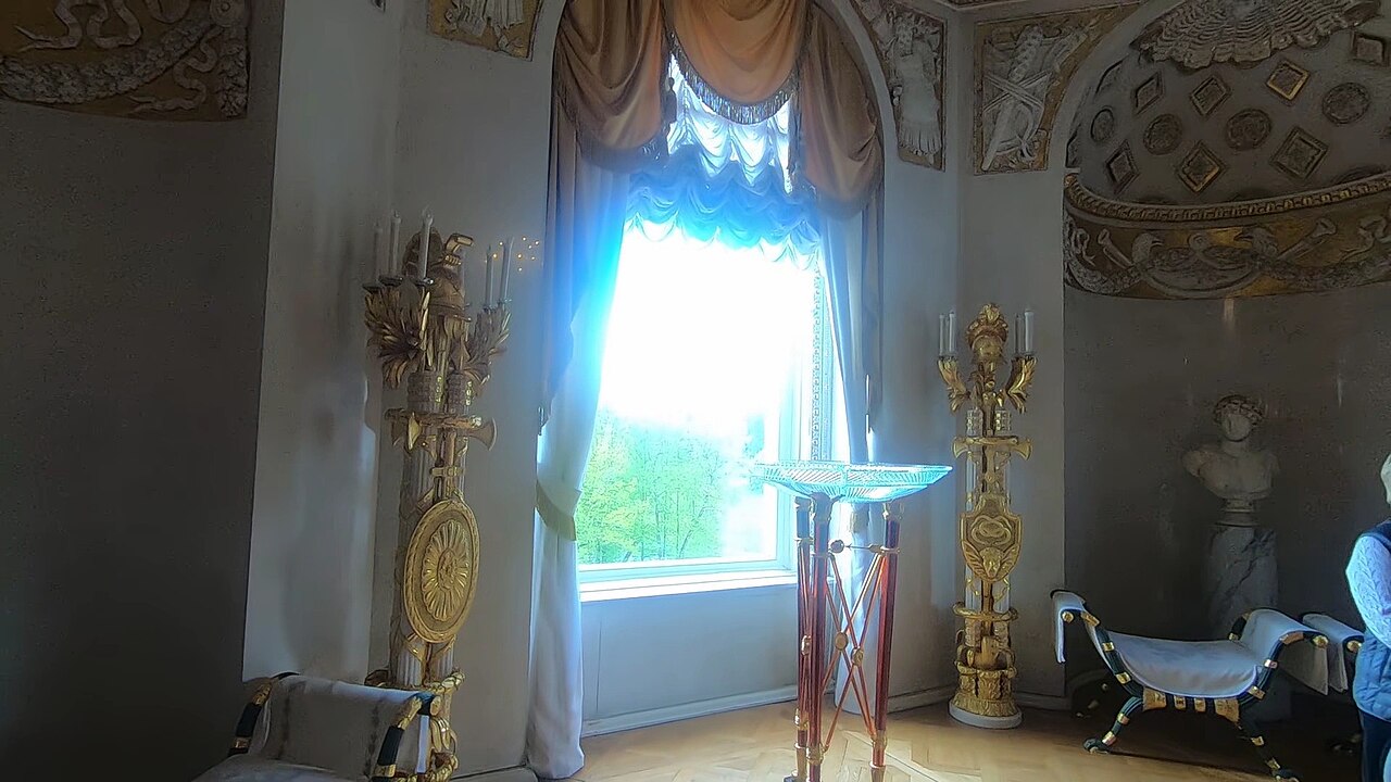 An elegant drawing room furnished with fine porcelain and art