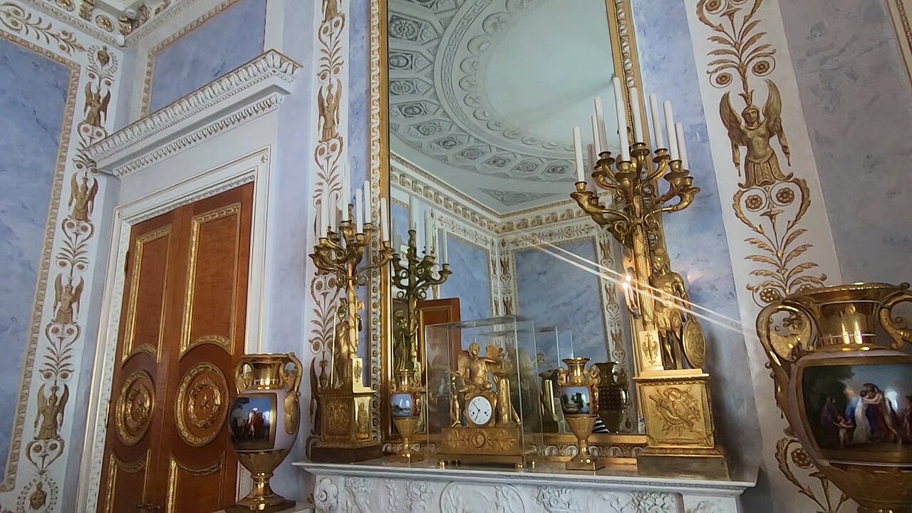 A classically decorated chamber with sculpture and antique motifs