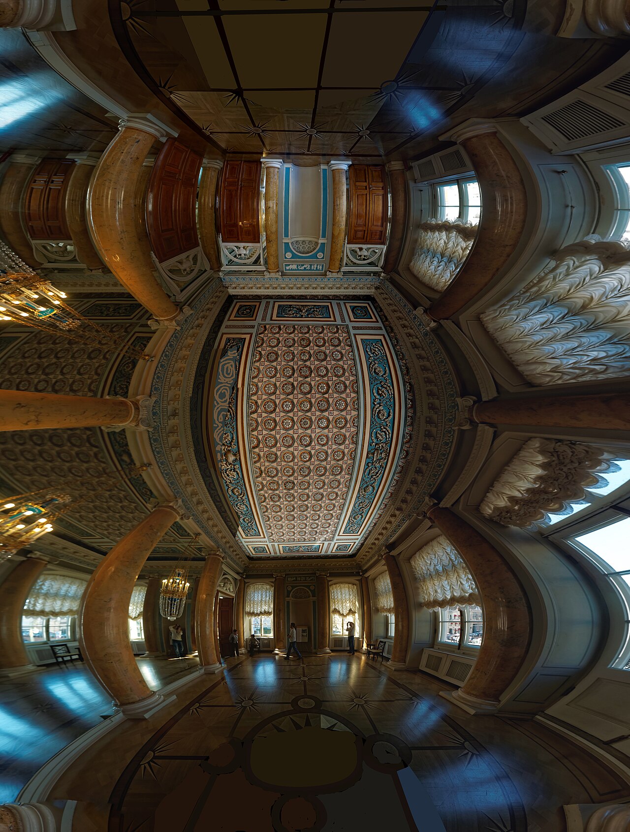 An ornate state room with gilded decoration